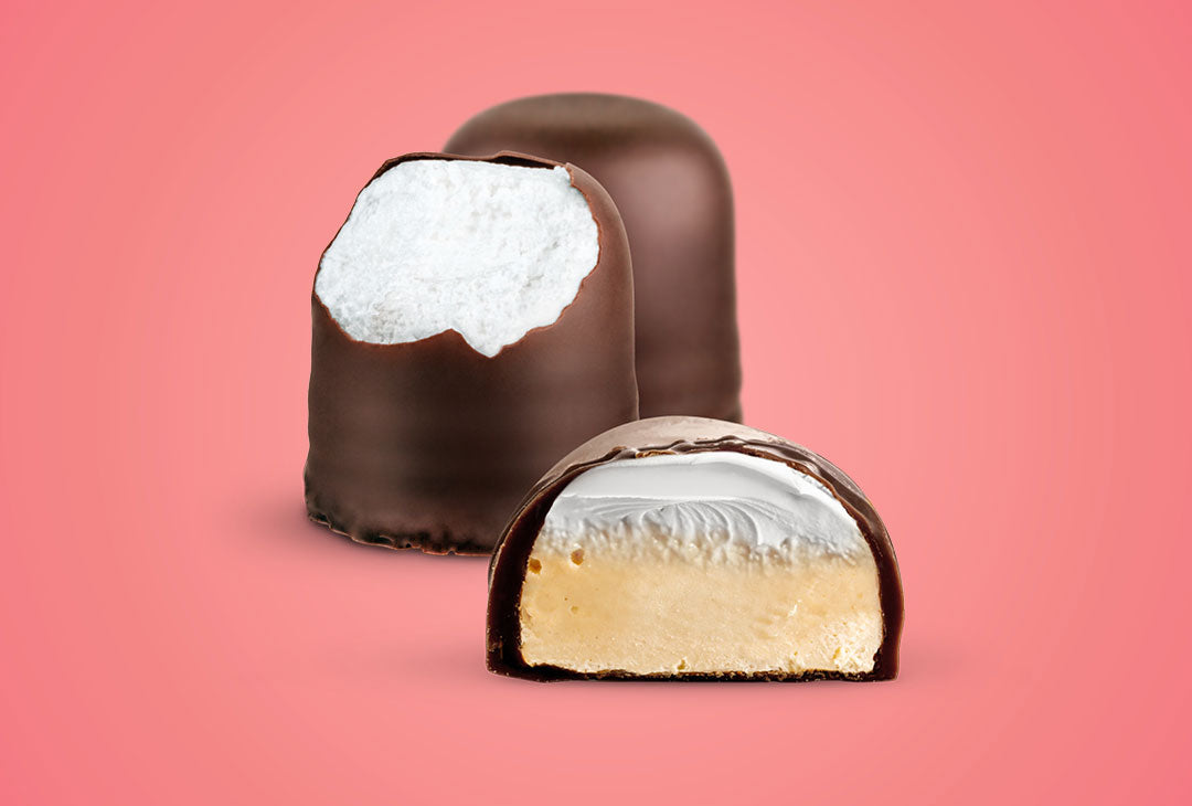 Vanilla Fluff & Flødebollen Filling and Cutaway view on a red background