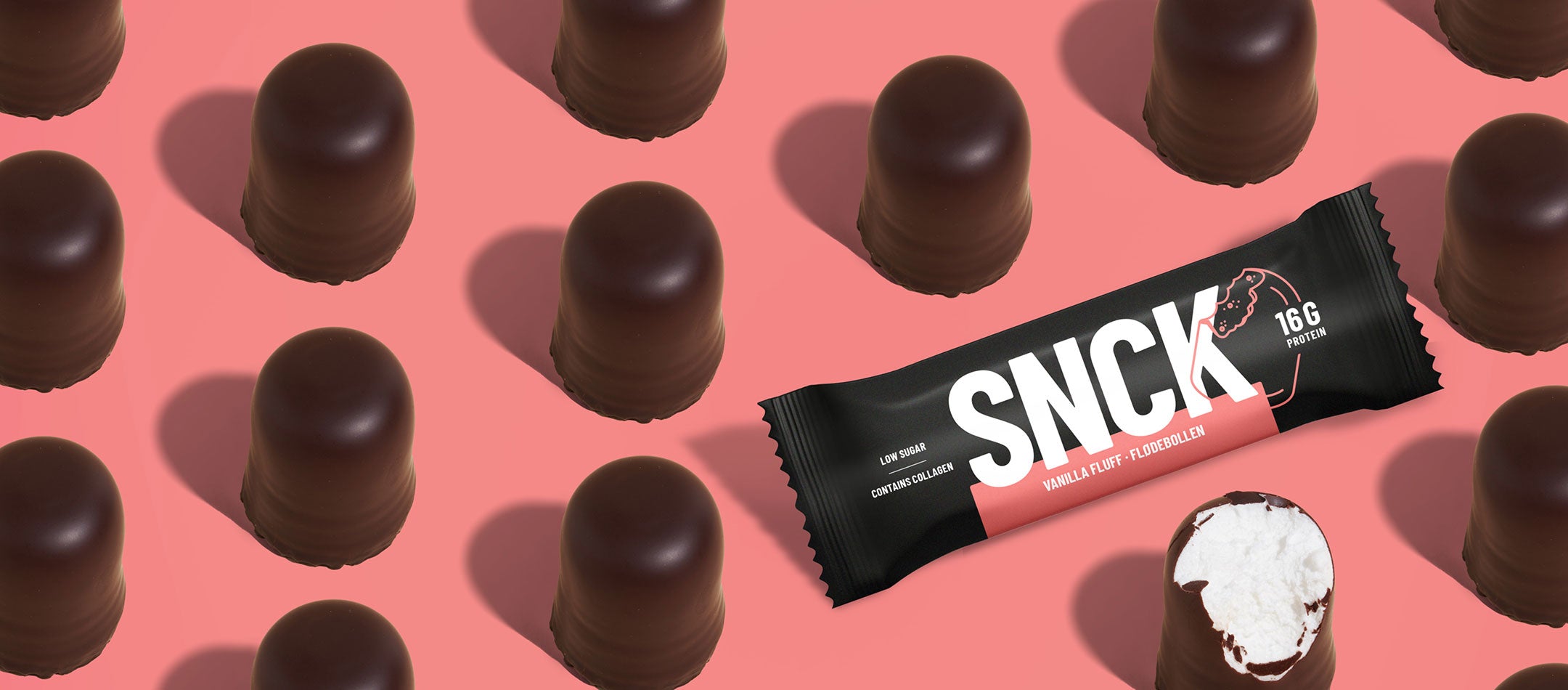 Chocolate candies with a SNCK bar on a pink background